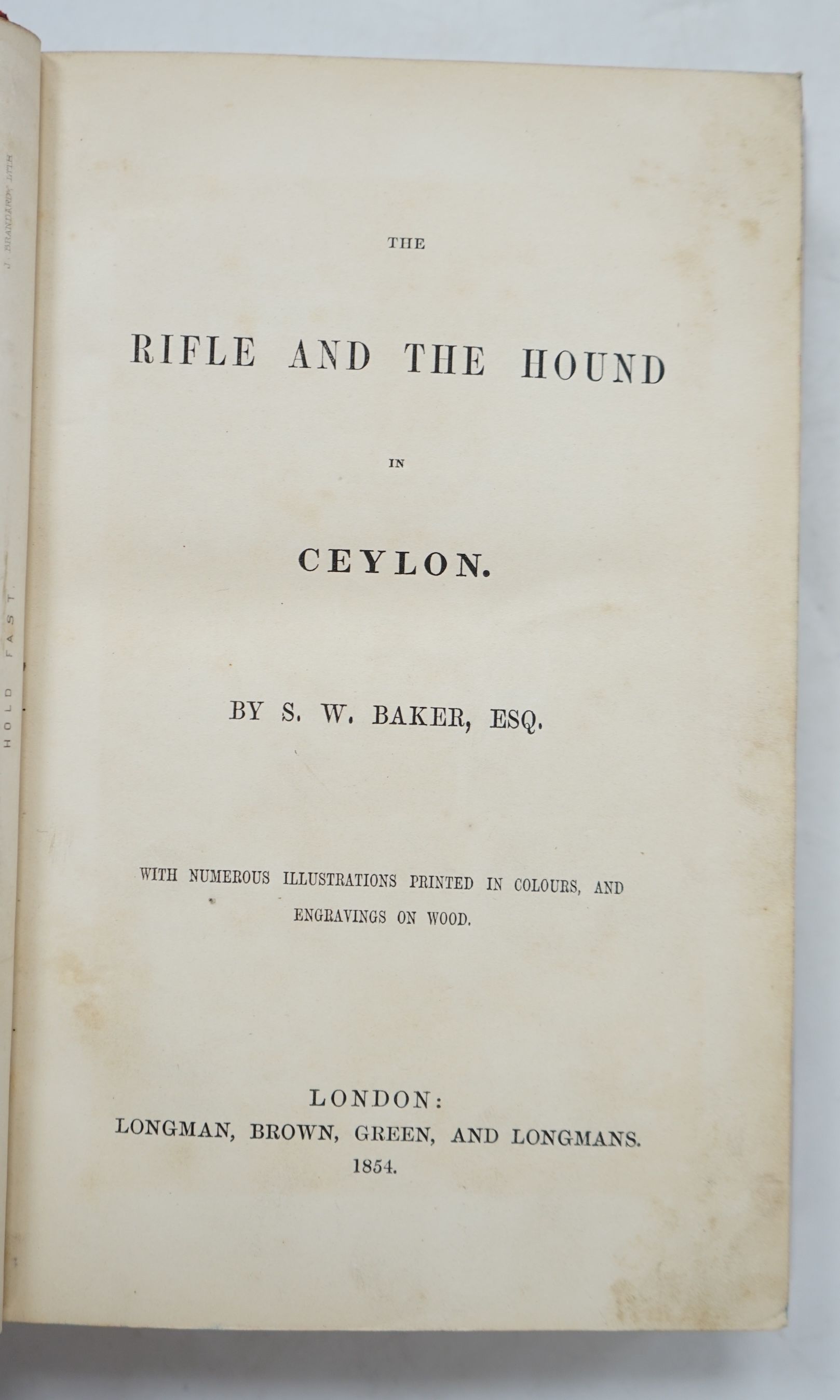 Baker, Sir Samuel White - The Rifle And The Hound in Ceylon, 1st edition. 6 chromolithographed plates. inc. frontis., few wood eng. illus., contemp. red half calf gilt, 8vo., Longman, Brown, Green and Longmans. 1854.